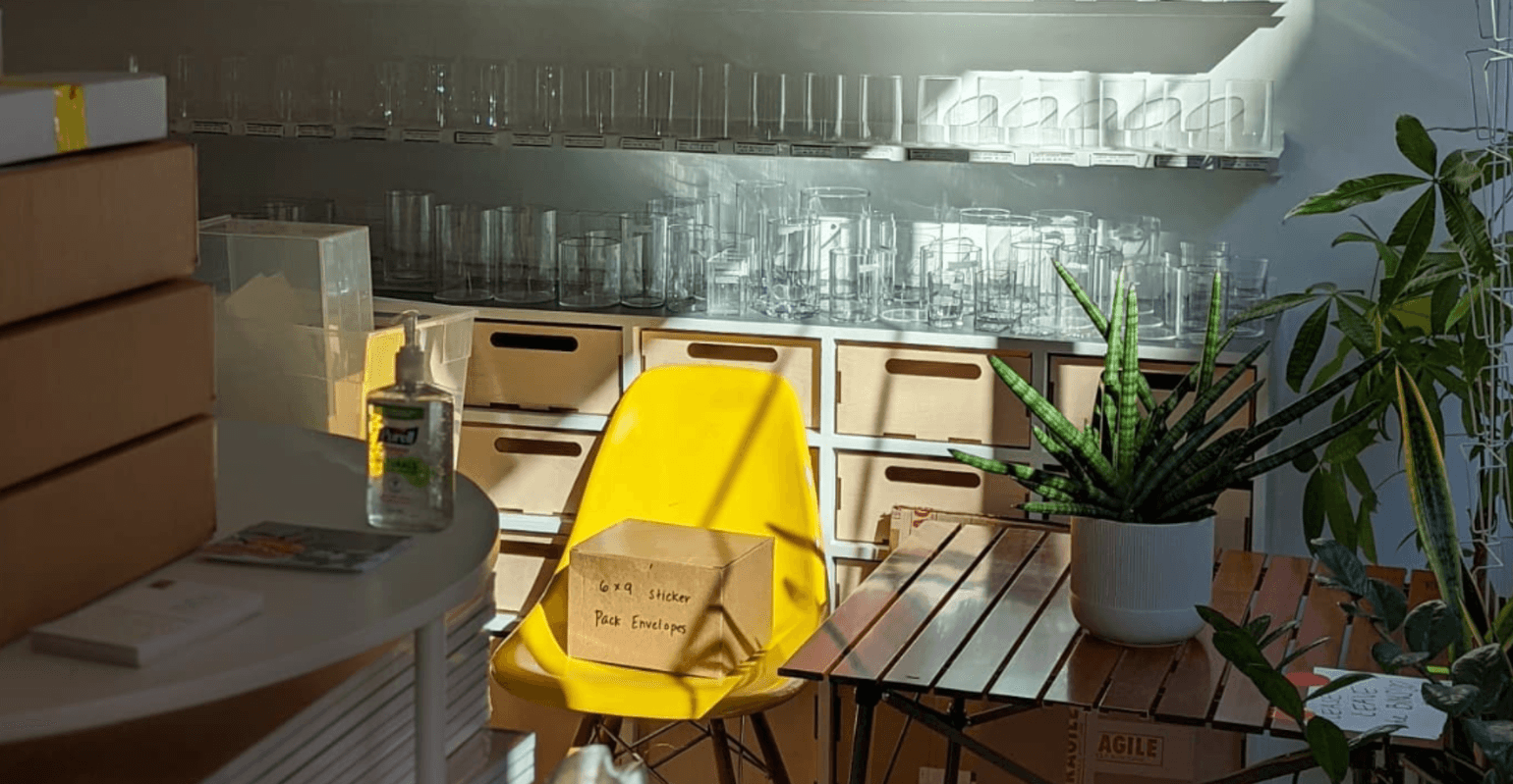 sunlit store interior with cardboard boxes