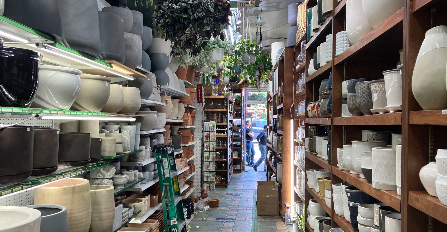 looking down the planter aisle at a hardware store