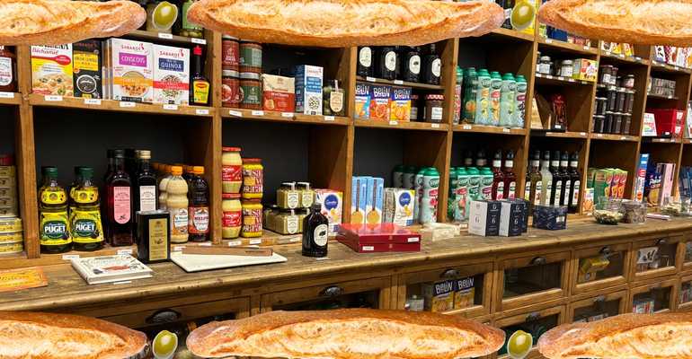 shelves stocked with french pantry items with photoshopped baguettes overlaid