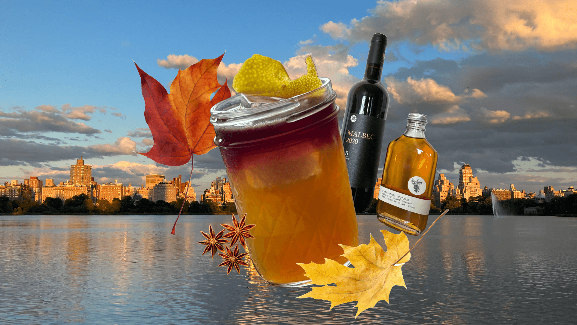 cocktail glass and autumn leaves float above the central park reservoir