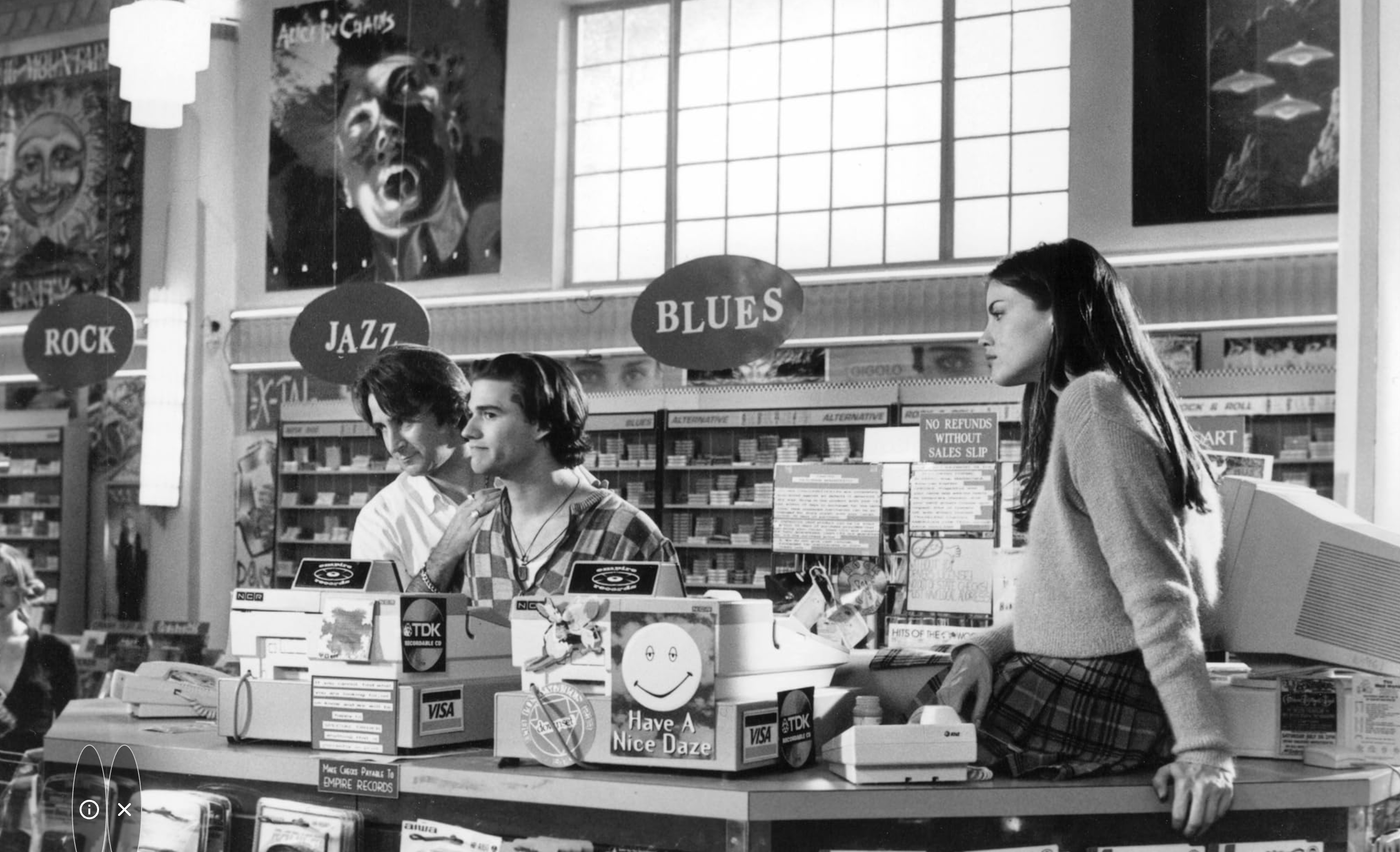 black and white movie still of teenagers working at a record shop